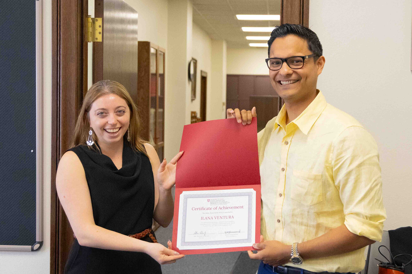 Ilana Ventura (left) with advisor Robert Vargas (right). The Stone Center coordinated to deliver the award as a surprise.