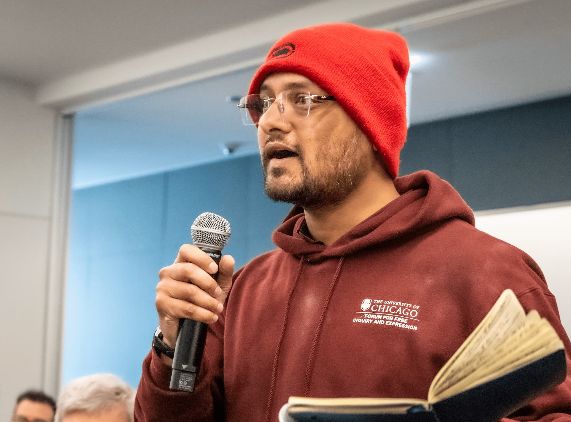 A participant raises a question during the Q&A session.