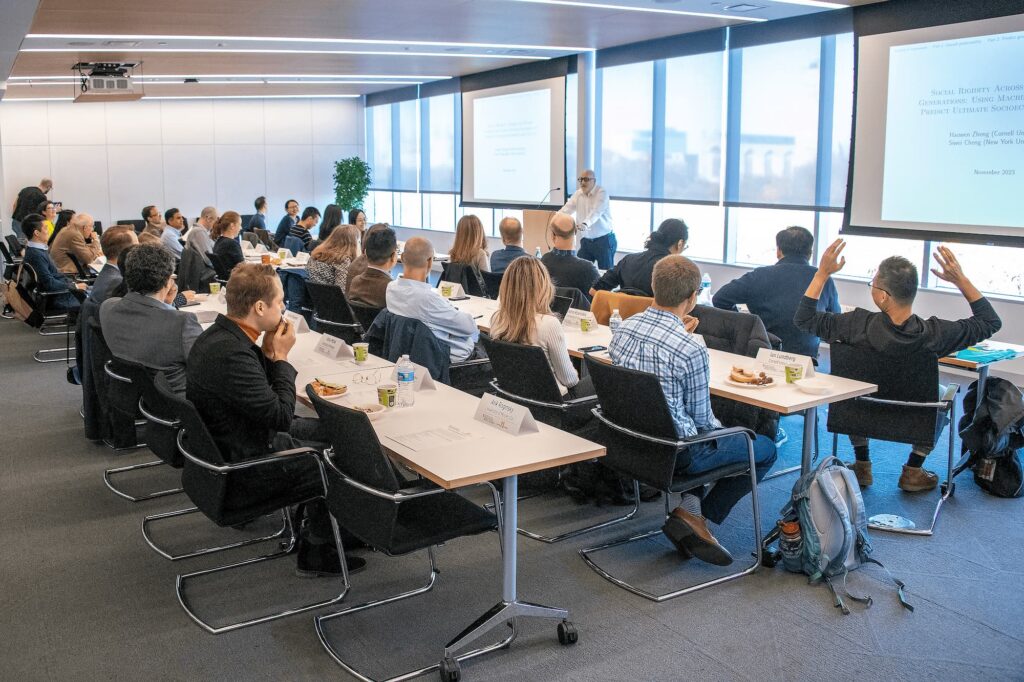 Audience members listen attentively during the lecture.