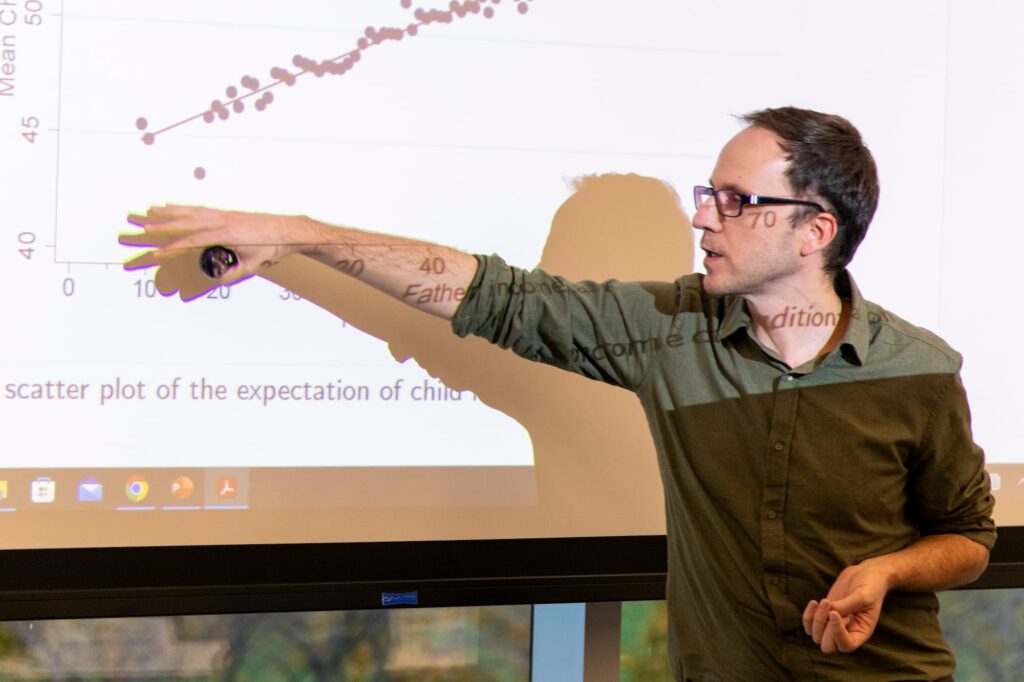 A speaker presents their ideas to the audience during the session.