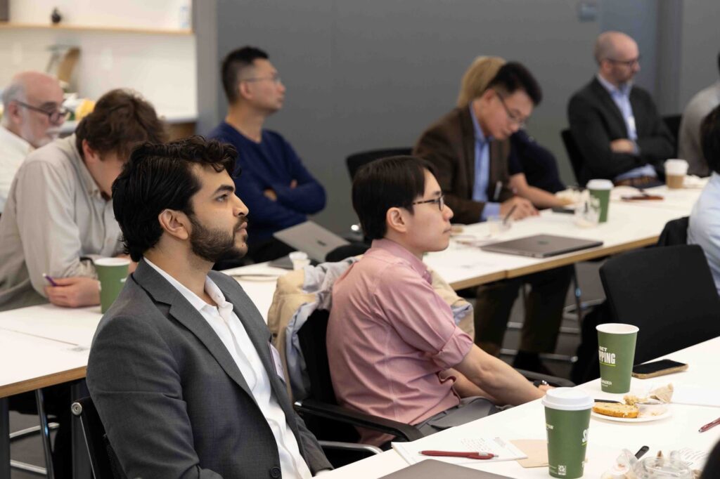 Audience members listen attentively during the lecture.