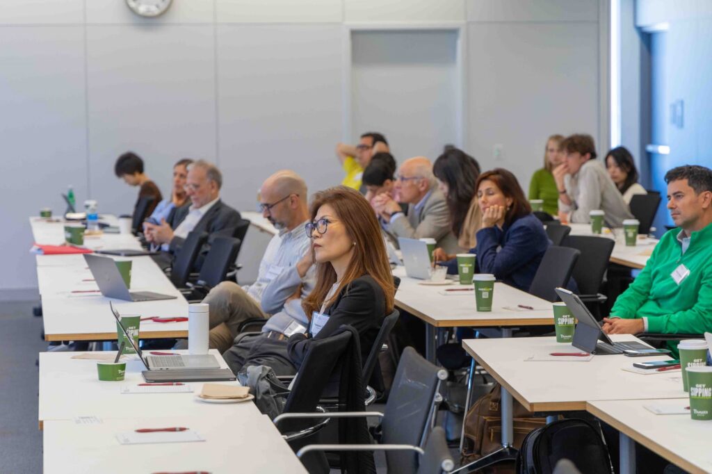 Audience members listen attentively during the lecture.