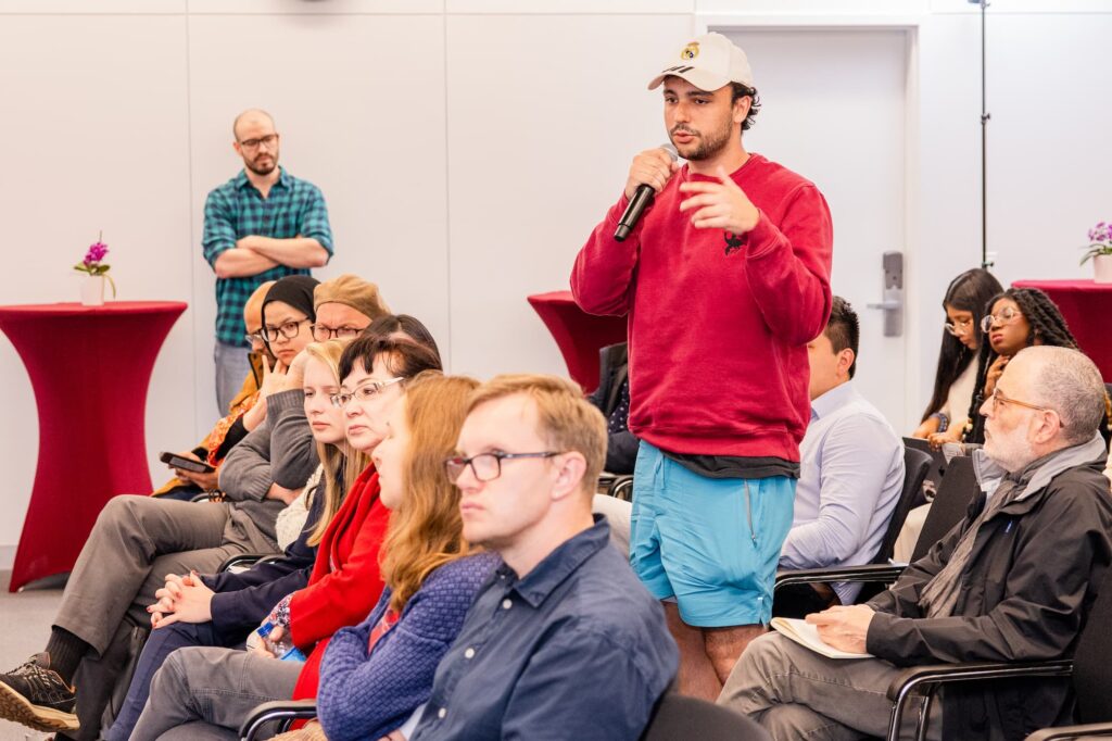A participant raises a question during the Q&A session.