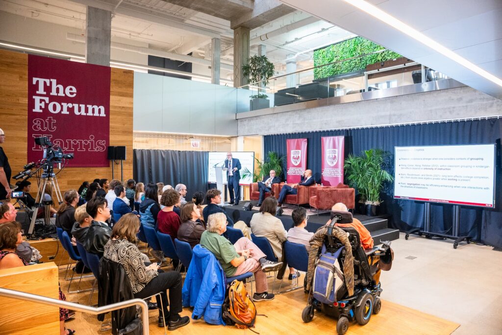 A wide view of the audience and panelists during the session.