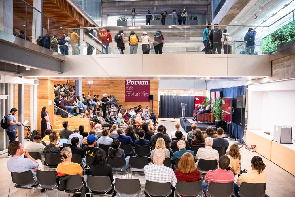 A wide view of the audience and panelists during the session.