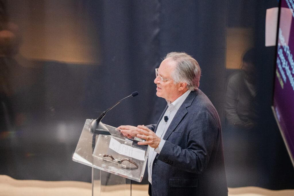 A panelist speaks from the podium during the session.