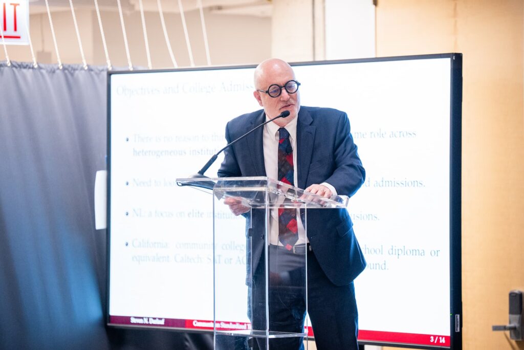 A panelist speaks from the podium during the session.