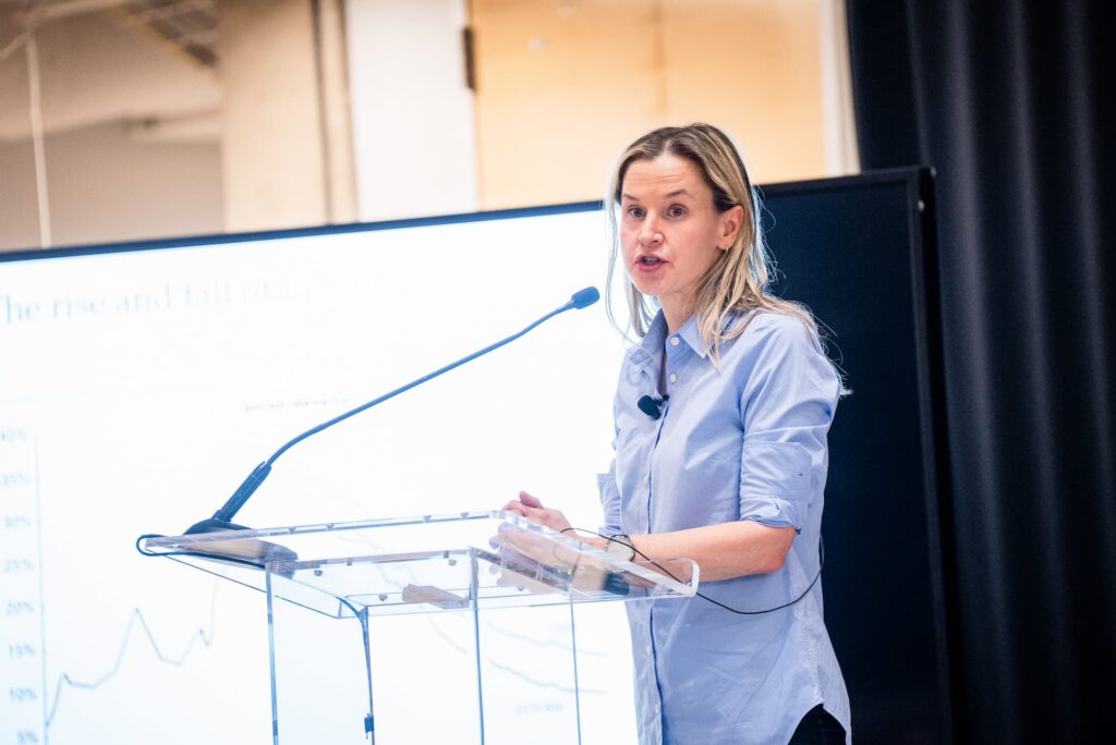 A panelist speaks from the podium during the session.