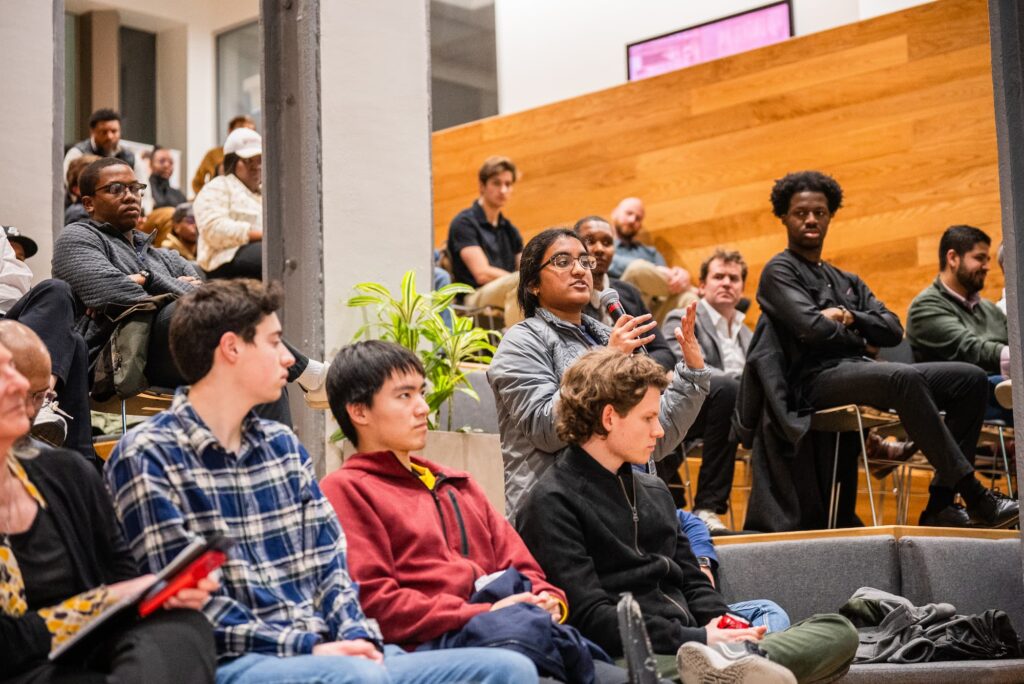 A participant raises a question during the Q&A session.