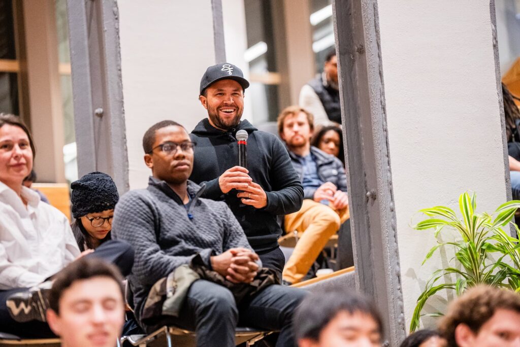 A participant raises a question during the Q&A session.