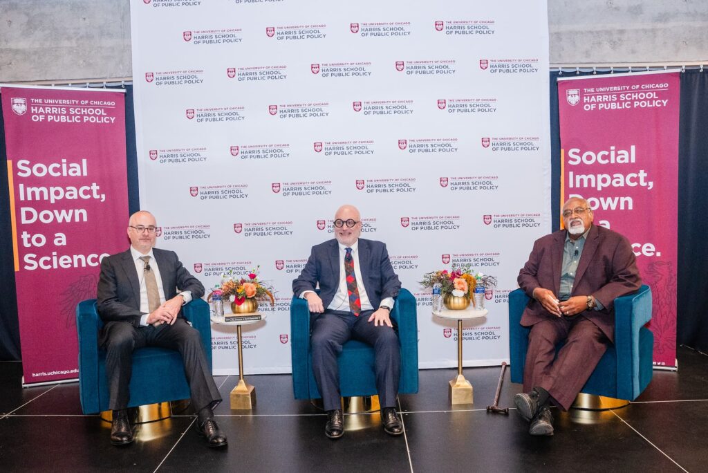 Panelists take their seats as the session is about to begin.
