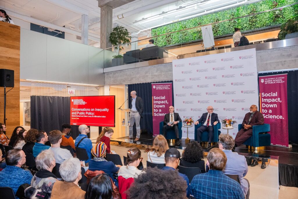 A wide view of the audience and panelists during the session.