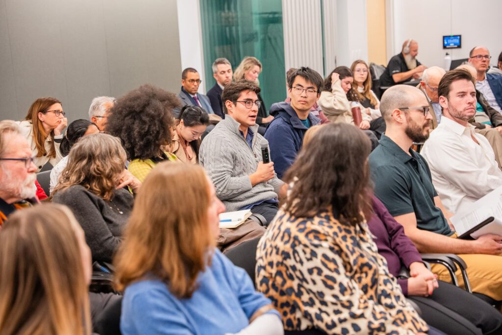 A participant raises a question during the Q&A session.