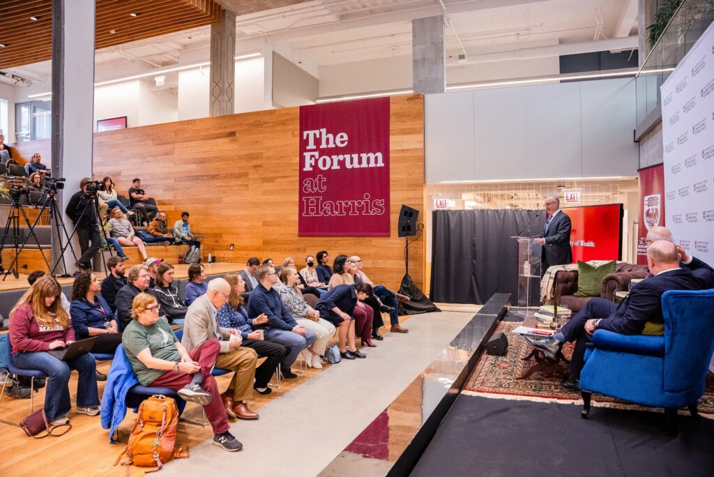 A wide view of the audience and panelists during the session.