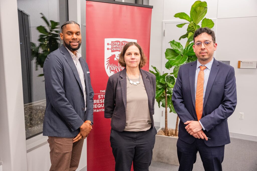 Panelists gather for a group photo following the discussion.
