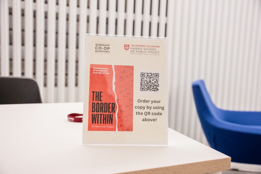 A framed display of the featured book on the table.