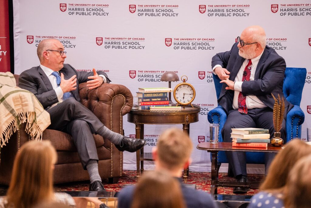 A candid moment of scholarly discussion.
