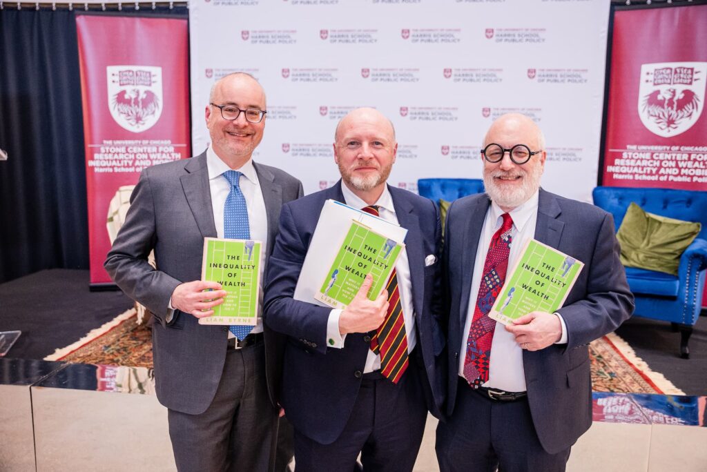 Panelists pose with the featured book following the session.