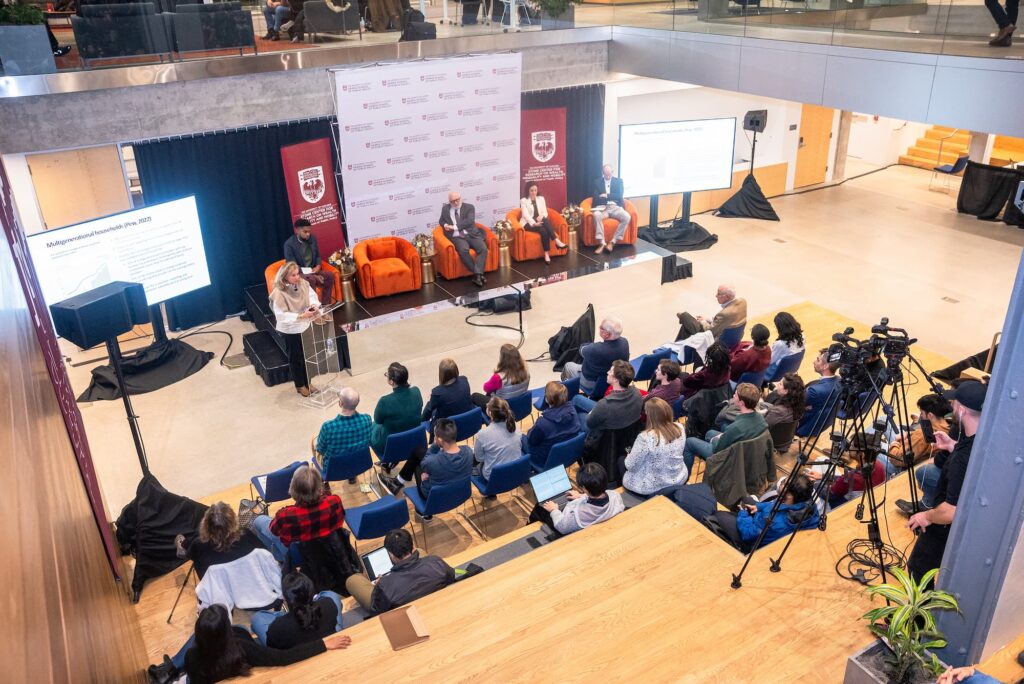 A wide view of the audience and panelists during the session.