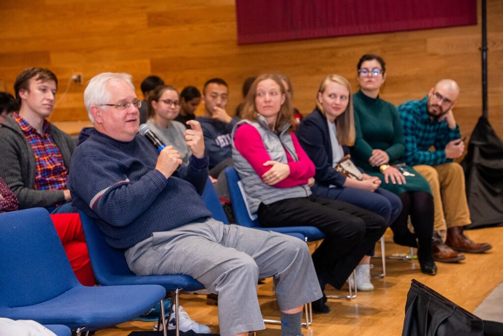 A participant raises a question during the Q&A session.