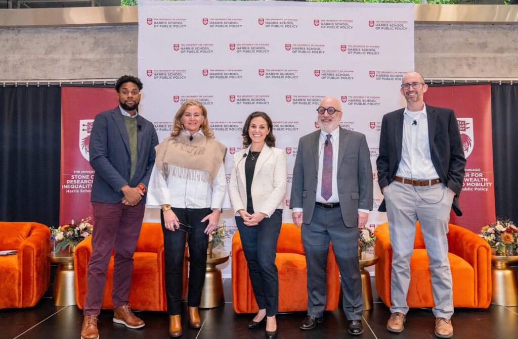 Panelists gather for a group photo before the discussion.
