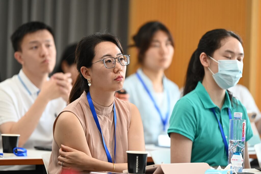Audience members listen attentively during the discussion.