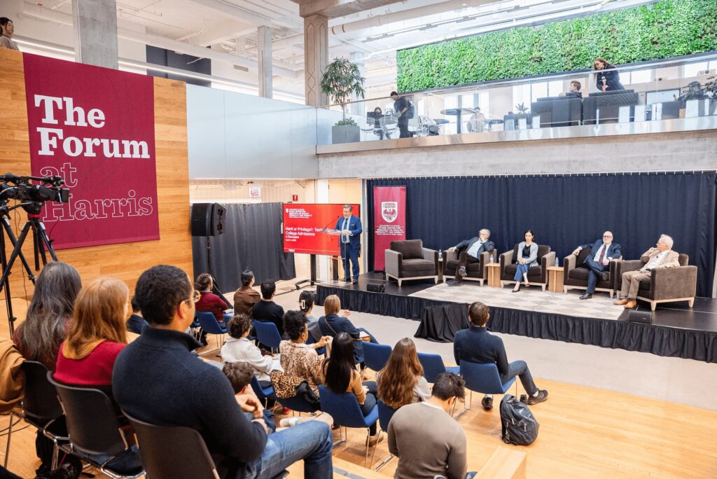 A wide view of the audience and panelists during the session.