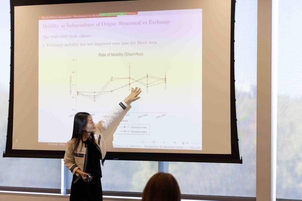 A speaker presents their ideas to the audience during the session.
