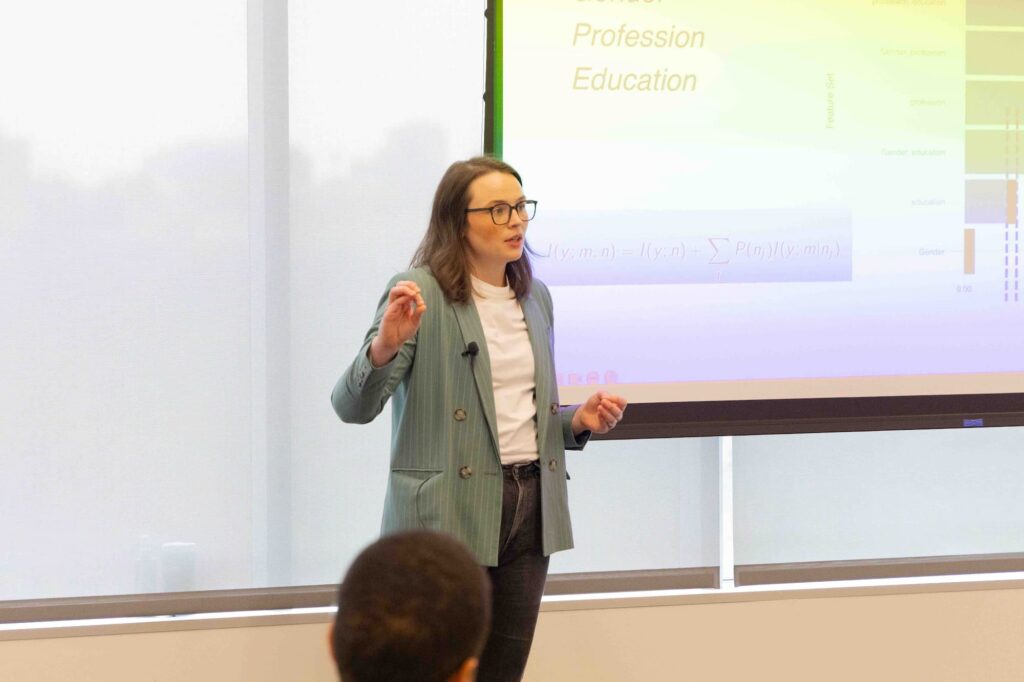 A speaker presents their ideas to the audience during the session.