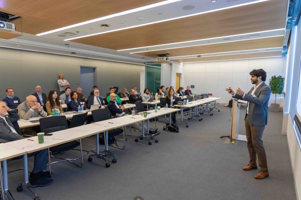 A speaker presents their ideas to the audience during the session.