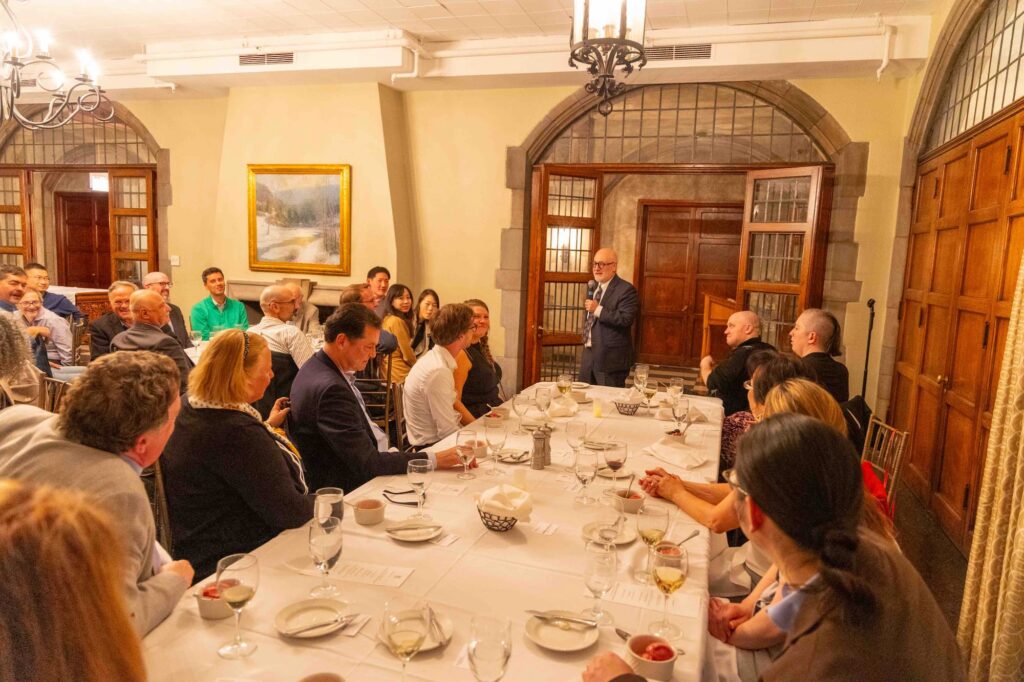 A speaker offers remarks during the dinner following the conference.