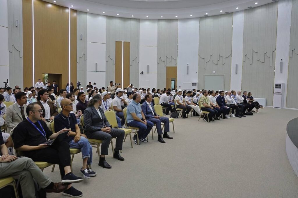 Audience members listen attentively during the discussion.