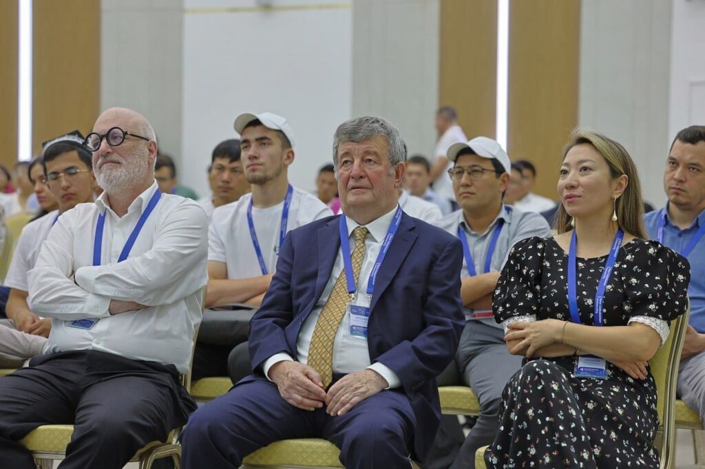 Audience members listen attentively during the discussion.