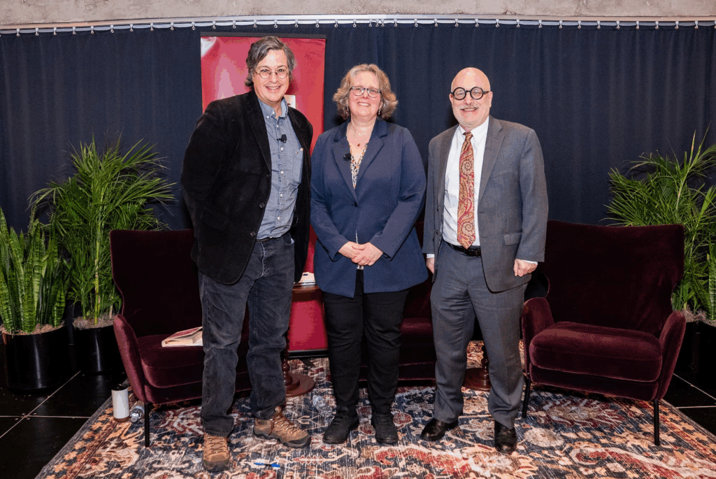 Panelists gather for a group photo following the discussion.